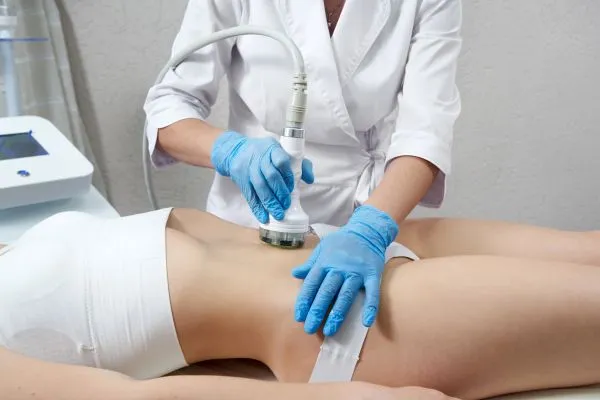 Lost the Weight but Not the Loose Skin? 2 woman having HIFU treatment on her stomach to combat loose skin Wakefield following weight loss
